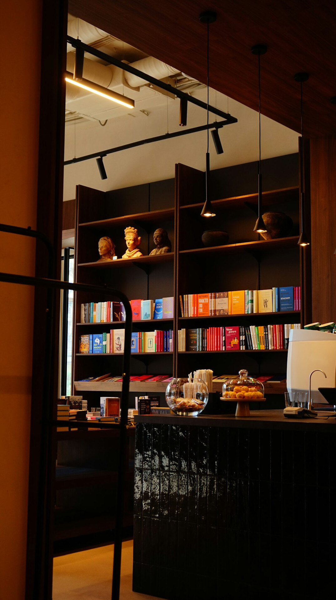 Quiet library with tall wooden shelves and warm light